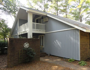 Exterior renovation included new siding and replacement of all wood trim and fascia.